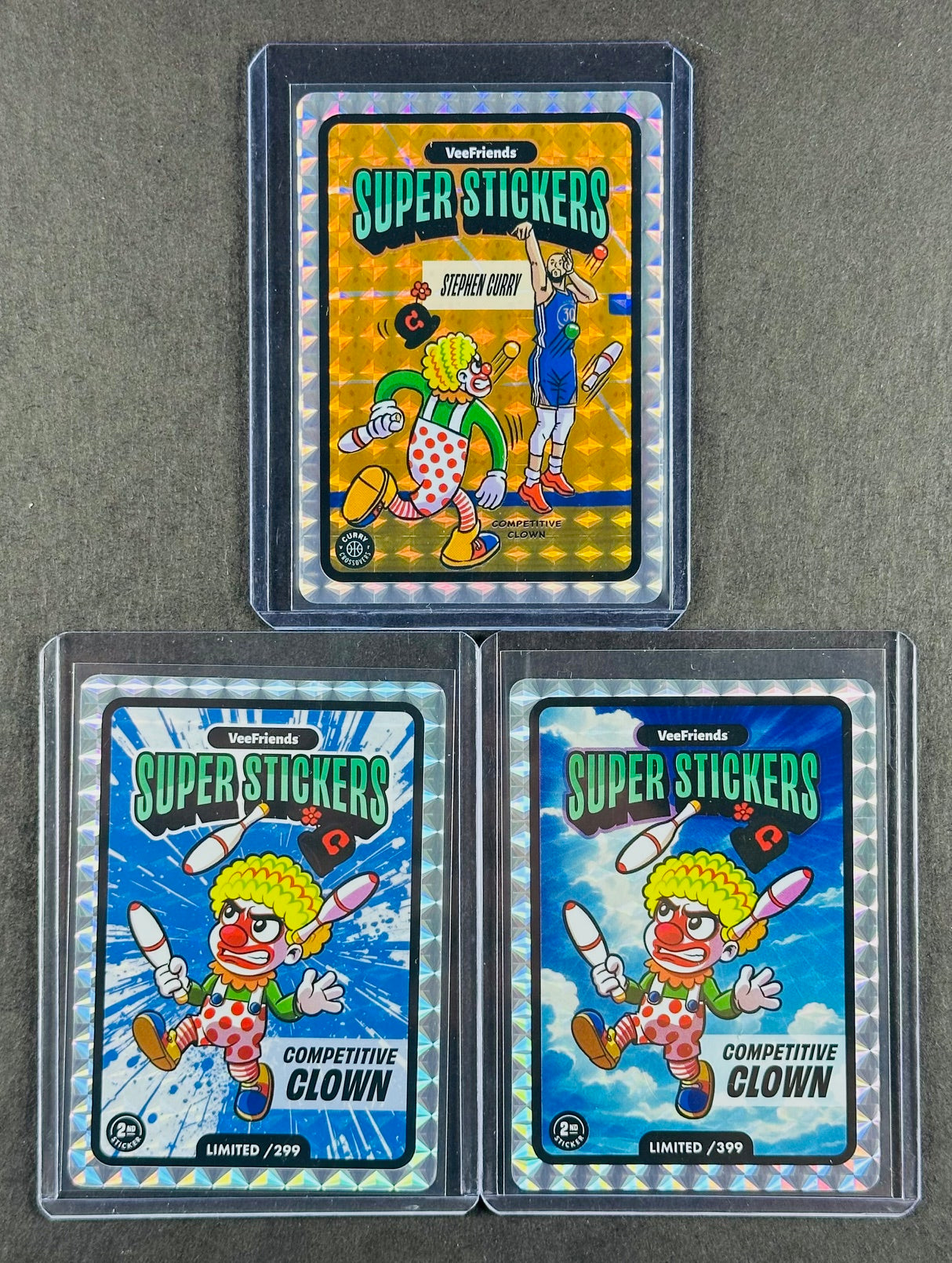 VeeFriends Super Stickers – Competitive Clown 3-Card Bundle – Blue Splash /299 + Manga Clouds /399 + Curry Crossover