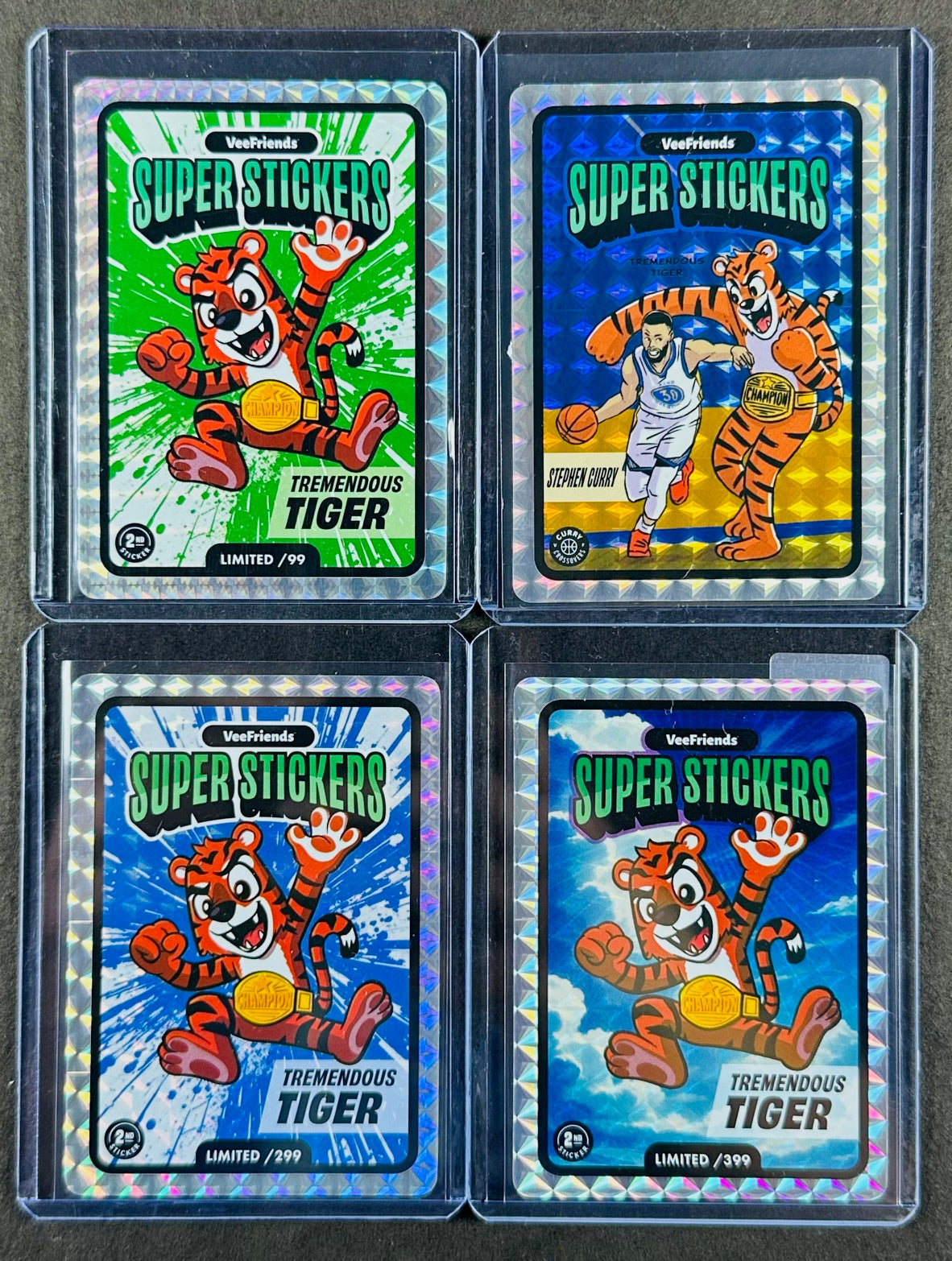 VeeFriends Super Stickers – Tremendous Tiger 4-Card Bundle – Green Splash /99 + Blue Splash /299 + Manga Clouds /399 + Curry Crossover