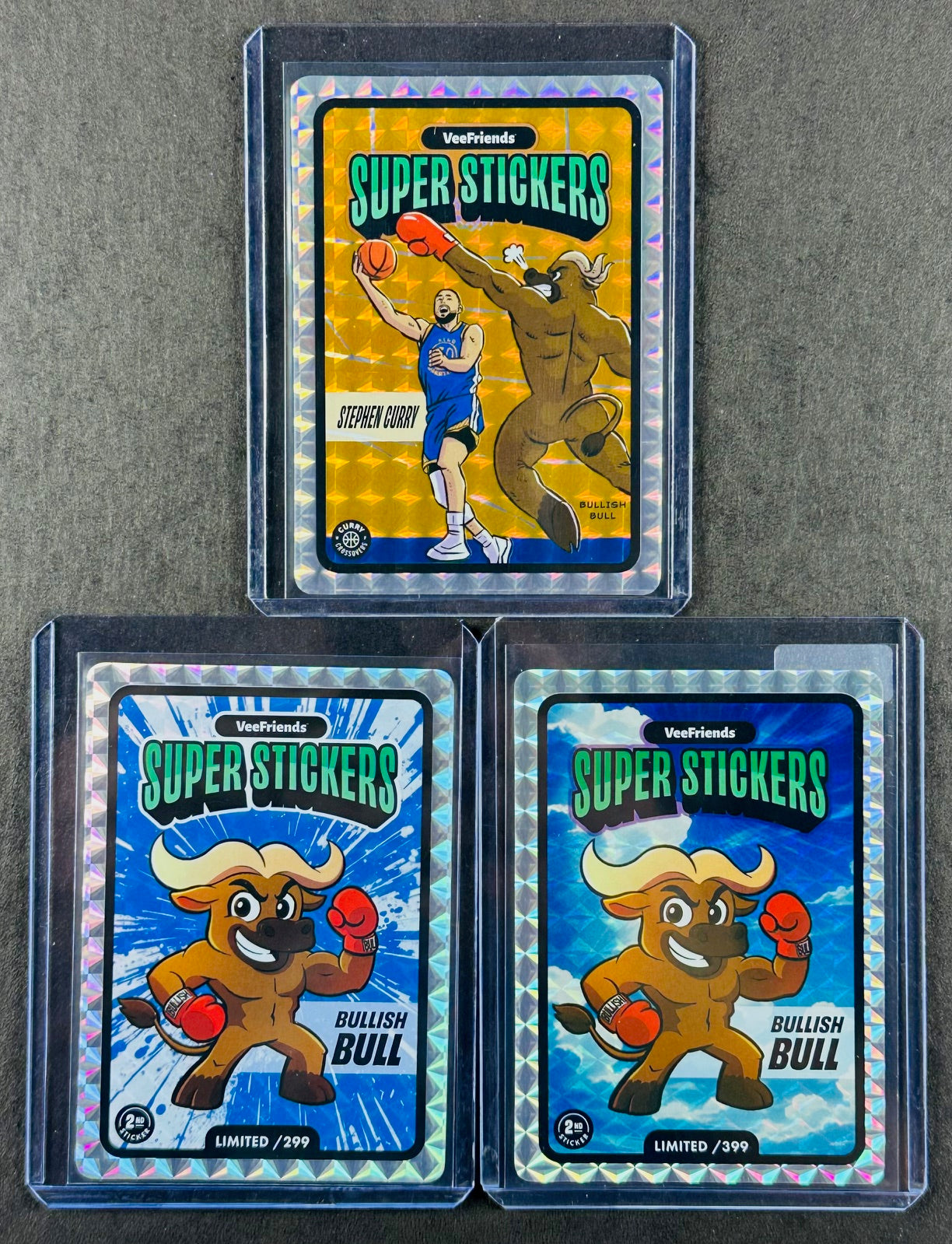 VeeFriends Super Stickers – Bullish Bull 3-Card Bundle – Blue Splash /299 + Manga Clouds /399 + Curry Crossover