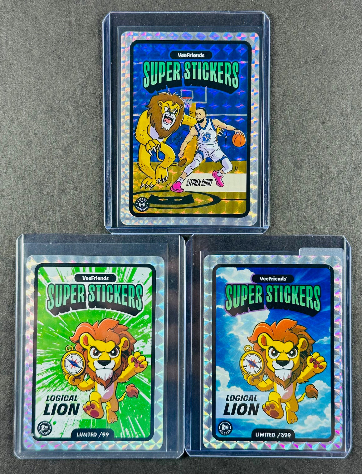 VeeFriends Super Stickers – Logical Lion 3-Card Bundle – Green Splash /99 + Manga Clouds /399 + Curry Crossover
