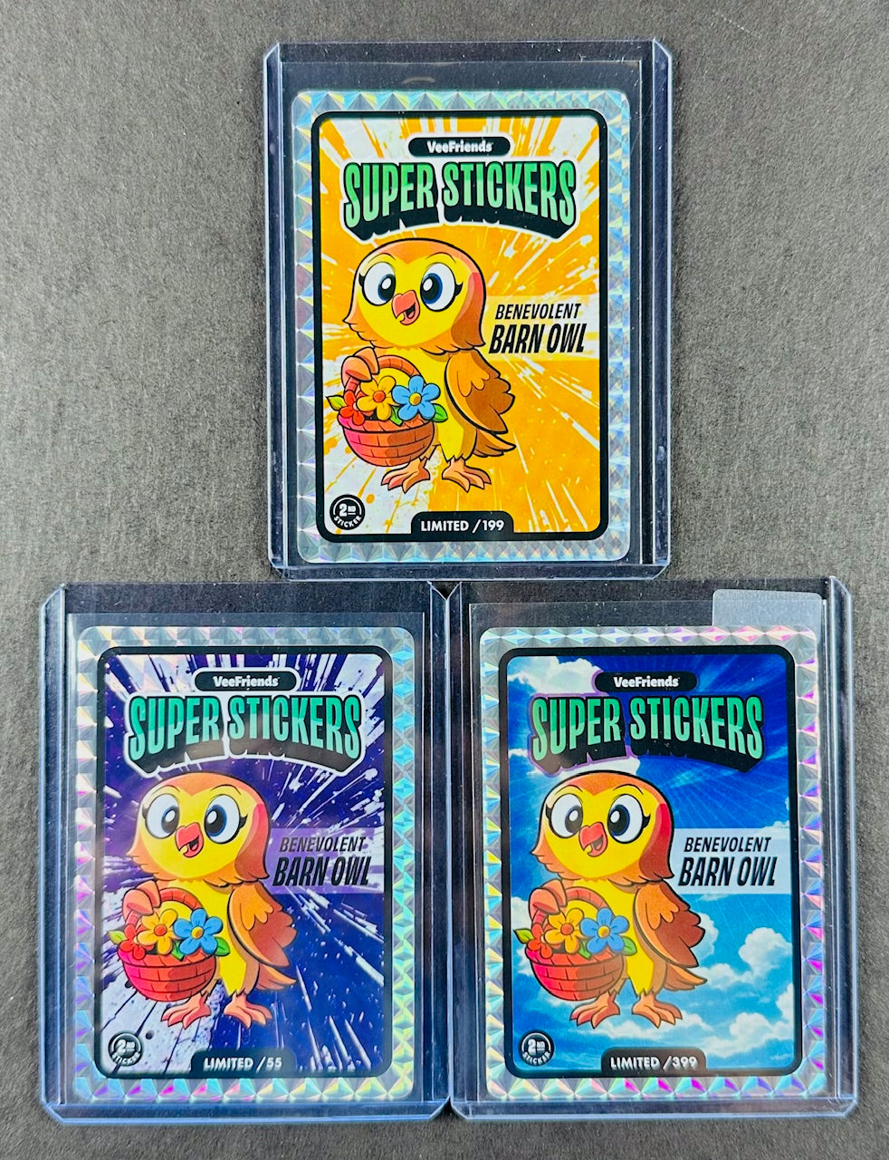 VeeFriends Super Stickers – Benevolent Barn Owl 3-Card Bundle – Orange Splash /199 + Purple Splash /55 + Manga Clouds /399