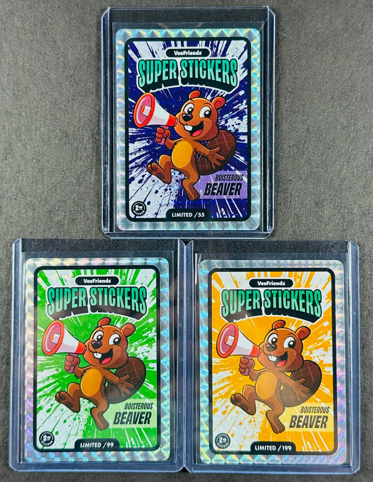 VeeFriends Super Stickers – Boisterous Beaver 3-Card Bundle – Purple Splash /55 + Green Splash /99 + Orange Splash /199